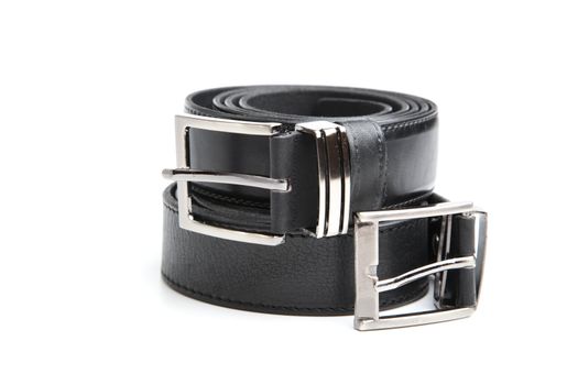 Two man's black belts on a white background