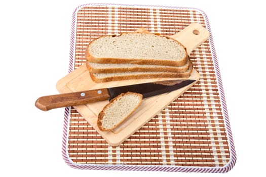Slices of bread  knife chopping board isolated on a white background