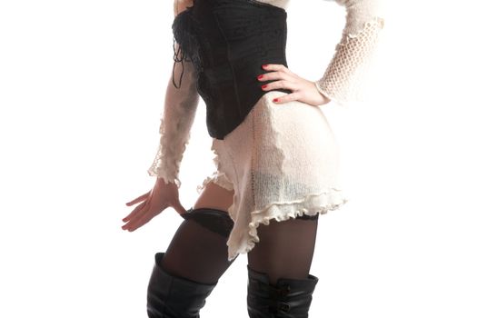 Trunk of the girl in stockings and jack boots on a white background
