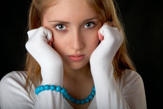 The girl with  beads and bracelet on  black background