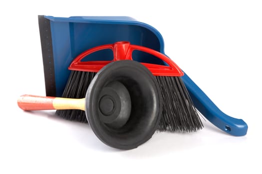 Scoop for dust,plunger and  brush on a white background