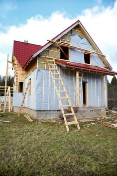 The under construction wooden house autumn