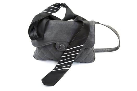 Female bag and man's tie isolated on a white background