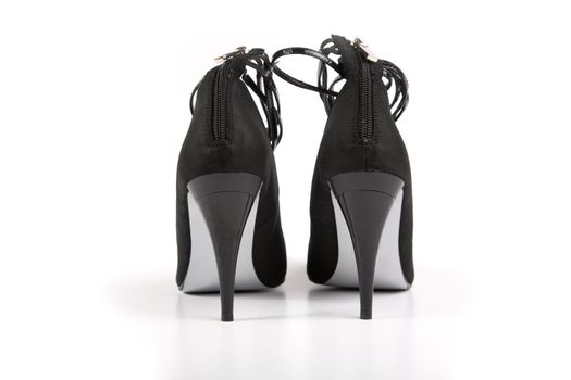 Woman black shoes on the white background