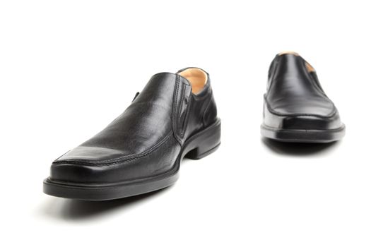 Pair of black man's shoes on a white background