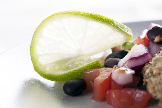 Lime garnish on black bean salsa.