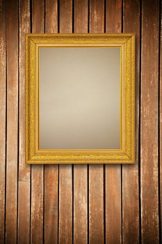 Gold frame on wood wall background