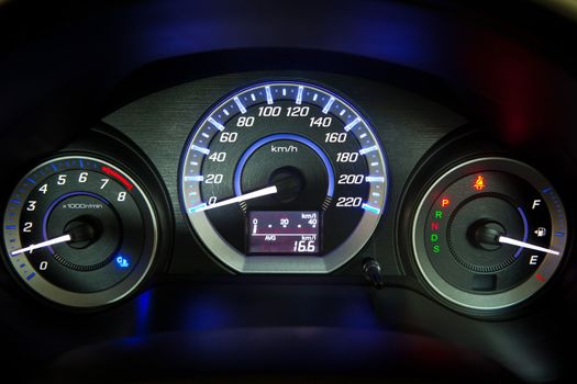Close up of car speedometer with starting car