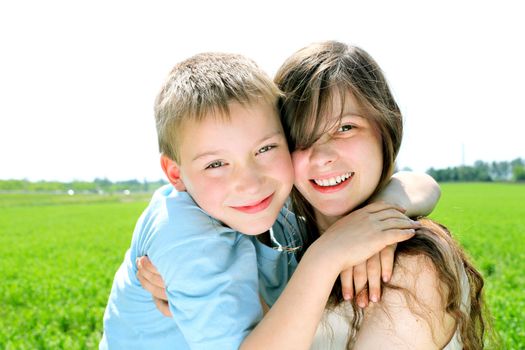 brother and sister in the summer field