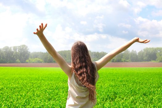 happy teenage girl in the summer field