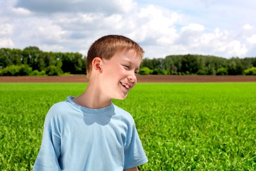 happy boy in the summer field