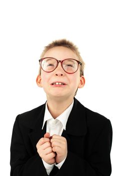 schoolboy in glasses begging pardon isolated on the white