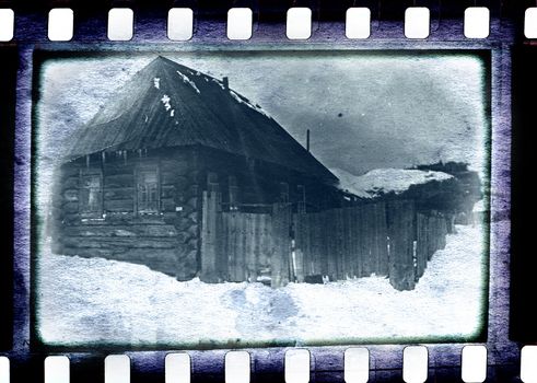 vintage dirty and spotted photo film with old small hause