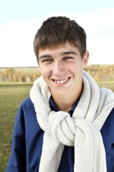smiling teenager portrait in the summer field