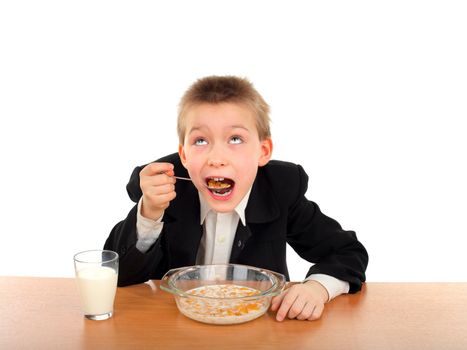 hungry schoolboy eating isolated on the white background