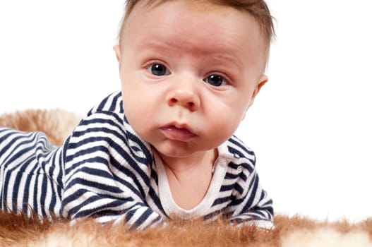 Shot of newborn baby lying on fur