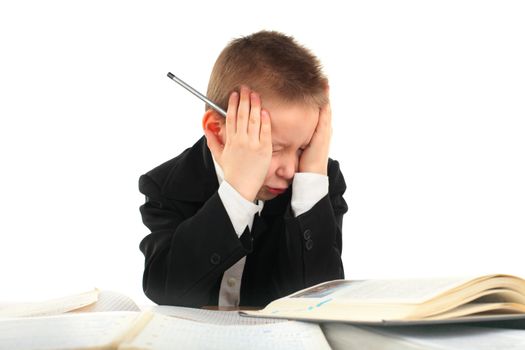 dissatisfied schoolboy on the table