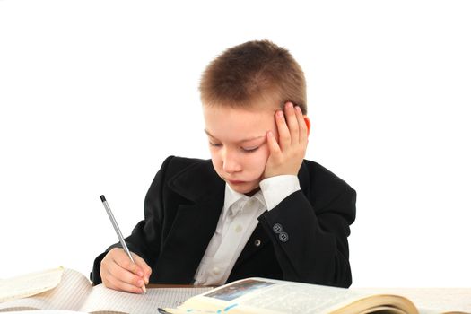 bored and tired schoolboy on the table