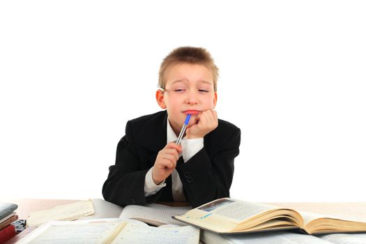 bored and tired schoolboy on the table