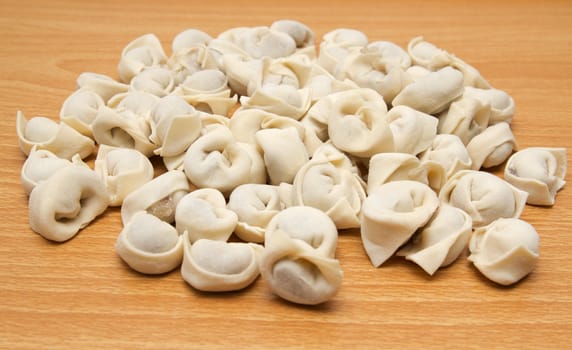 homemade meat dumplings on a cutting board 