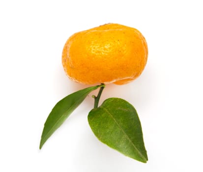 Ripe mandarin with green leaf isolated on white background