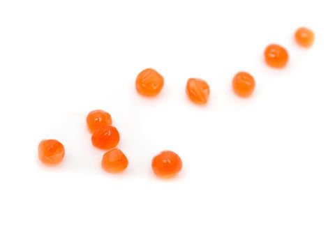 red caviar on white background. macro