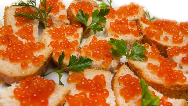 red caviar on bread with parsley