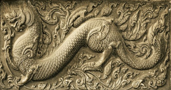 Dragon Chinese carved on stone wal