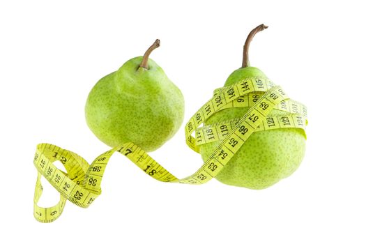 Ripe green pear with measuring tape