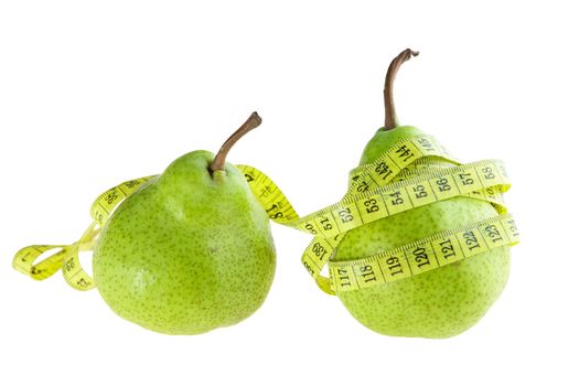 Ripe green pear with measuring tape