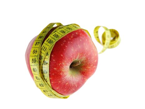 Ripe red apple with measuring tape 