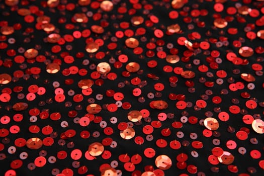 Black fabric embroidered with red tinse