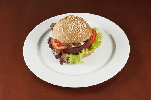 Macrobiotic burger on the white plate