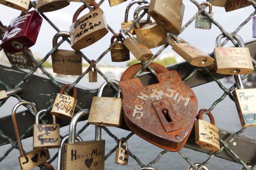 Padlock on the bridge over river Seine in Paris