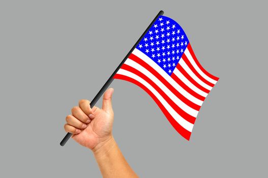 Hand holding America flag isolated on white background