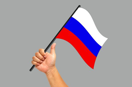 Hand holding russia flag isolated on white background