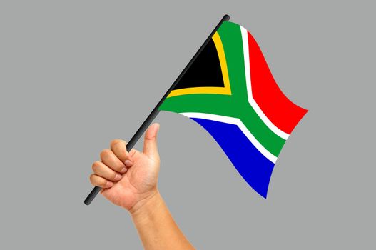 Hand holding south africa flag isolated on white background