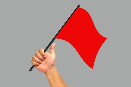 Hand holding red flag isolated on white background