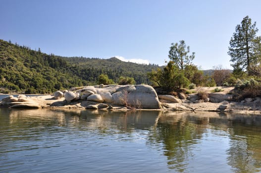 View of the rocky shoreline found around Lake Hemet in the Southern California mountains.