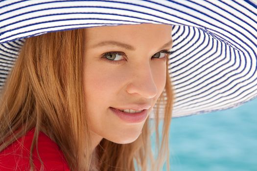portrait of a beautiful young girl who rests on the coast