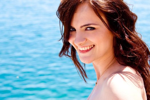 portrait of a beautiful young girl who rests on the coast