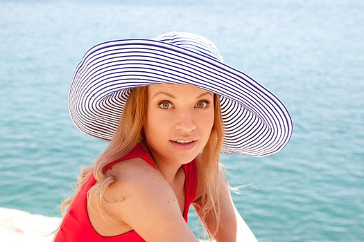 portrait of a beautiful young girl who rests on the coast