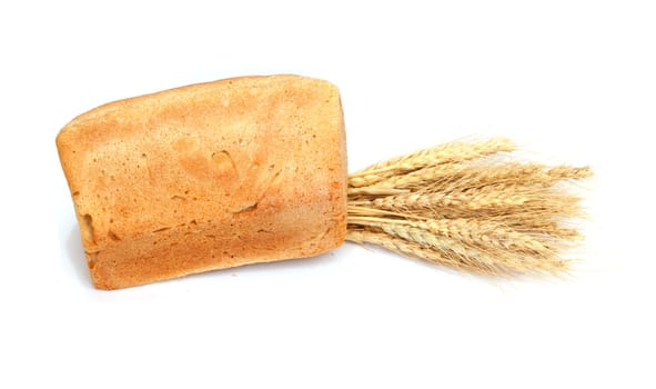 Bread and wheat on a white background 