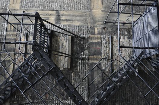 Metal fire escape ladder in an old building.