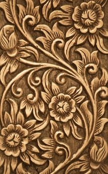 Pattern of flower carved on wood background