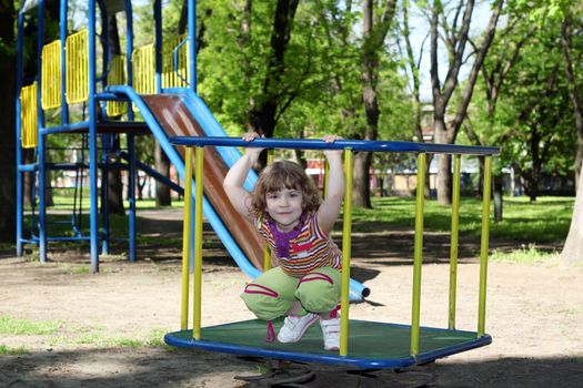little girl posing on playground