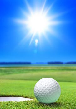 golf ball on green course near the bunker