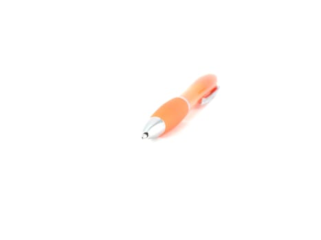 Orange ball-point pen over white. Shallow DOF.