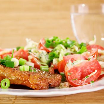 Fried meat with vegetable garnish