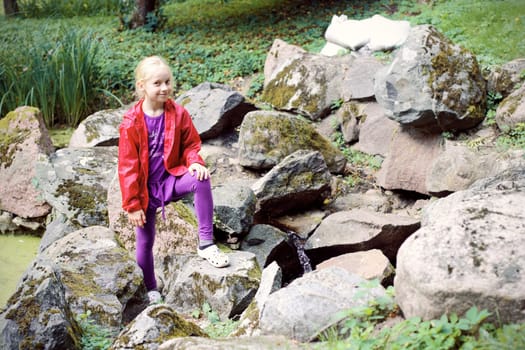 Portrait of Little Girl in Autumn Park